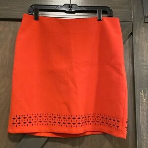 Orange soft knit mini skirt. Size 10.